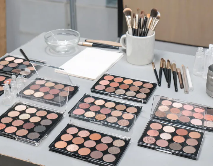 Eyeshadow Palette Sourcing on a cosmetics bench, illustration only